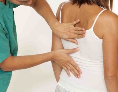A patient complaining of pain in the shoulder blades on both sides during a doctor's appointment